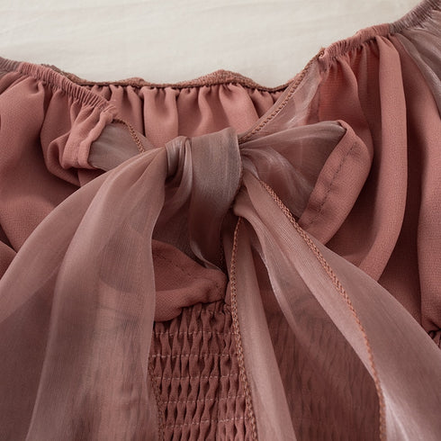 バックリボンシアートップス